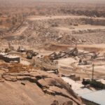 Aerial shot of a large quarry in Kaduna, Nigeria, during the day.