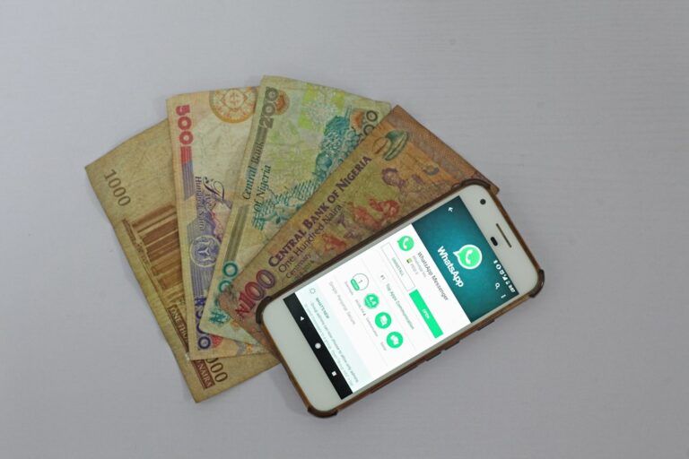 Sending money to DRC — smartphone and banknotes