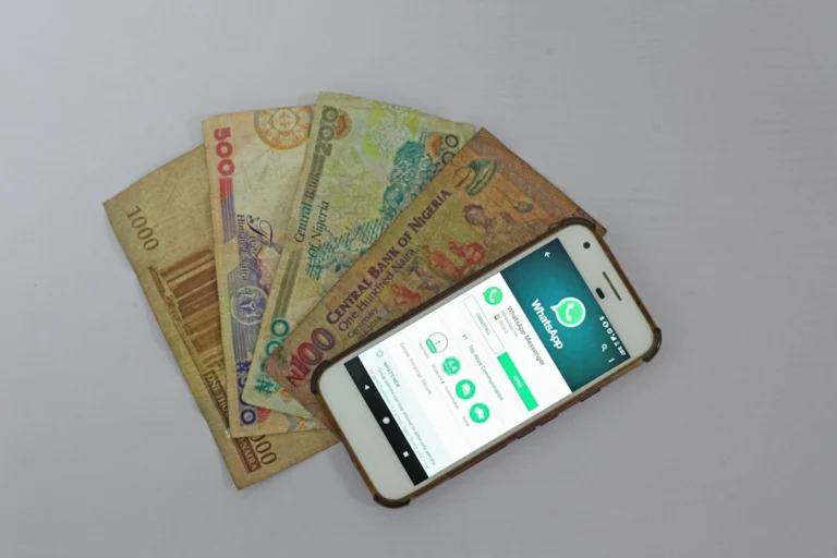 Sending money to DRC — smartphone and banknotes